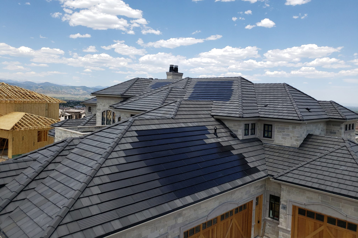 A home with a tile roof with Suntegra solar tiles built in.